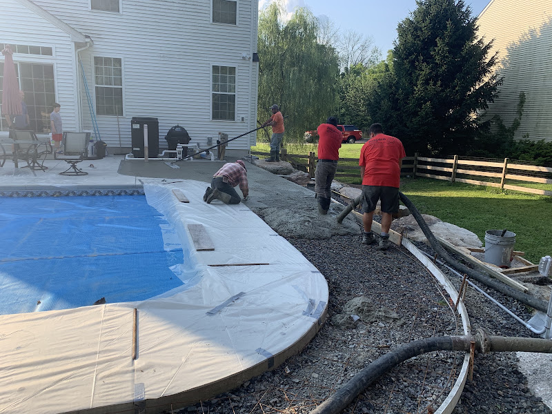 Inspire Contracting crew pouring a concrete pool deck Inspire Contracting crew pouring a concrete pool deck