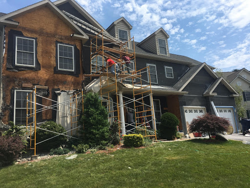 Stucco-to-siding conversion in progress by Inspire Contracting Stucco-to-siding conversion in progress by Inspire Contracting